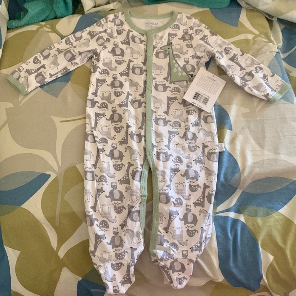 Brand NWT. 6-9 months footie pjs